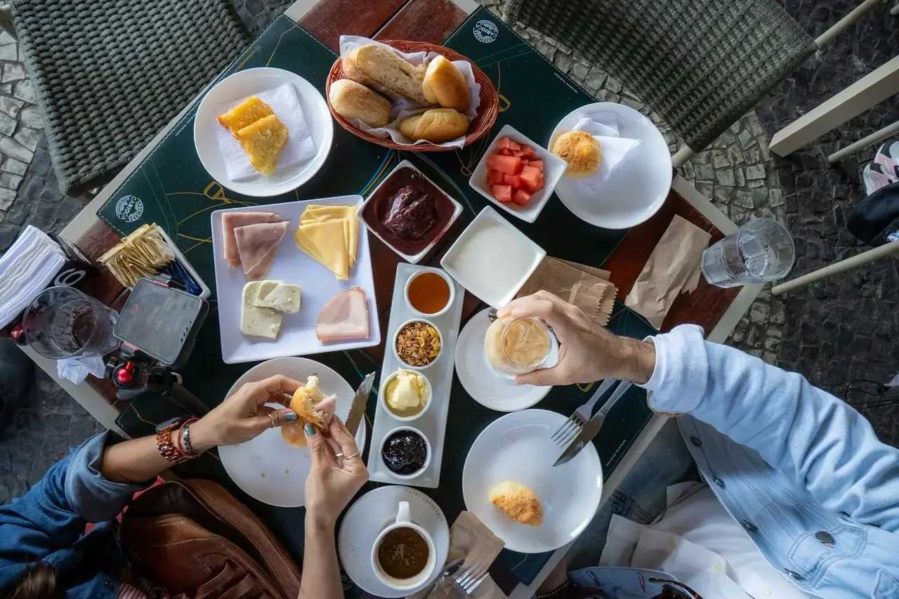 Couple enjoying breakfast at Embaixada Carioca — top view of the table